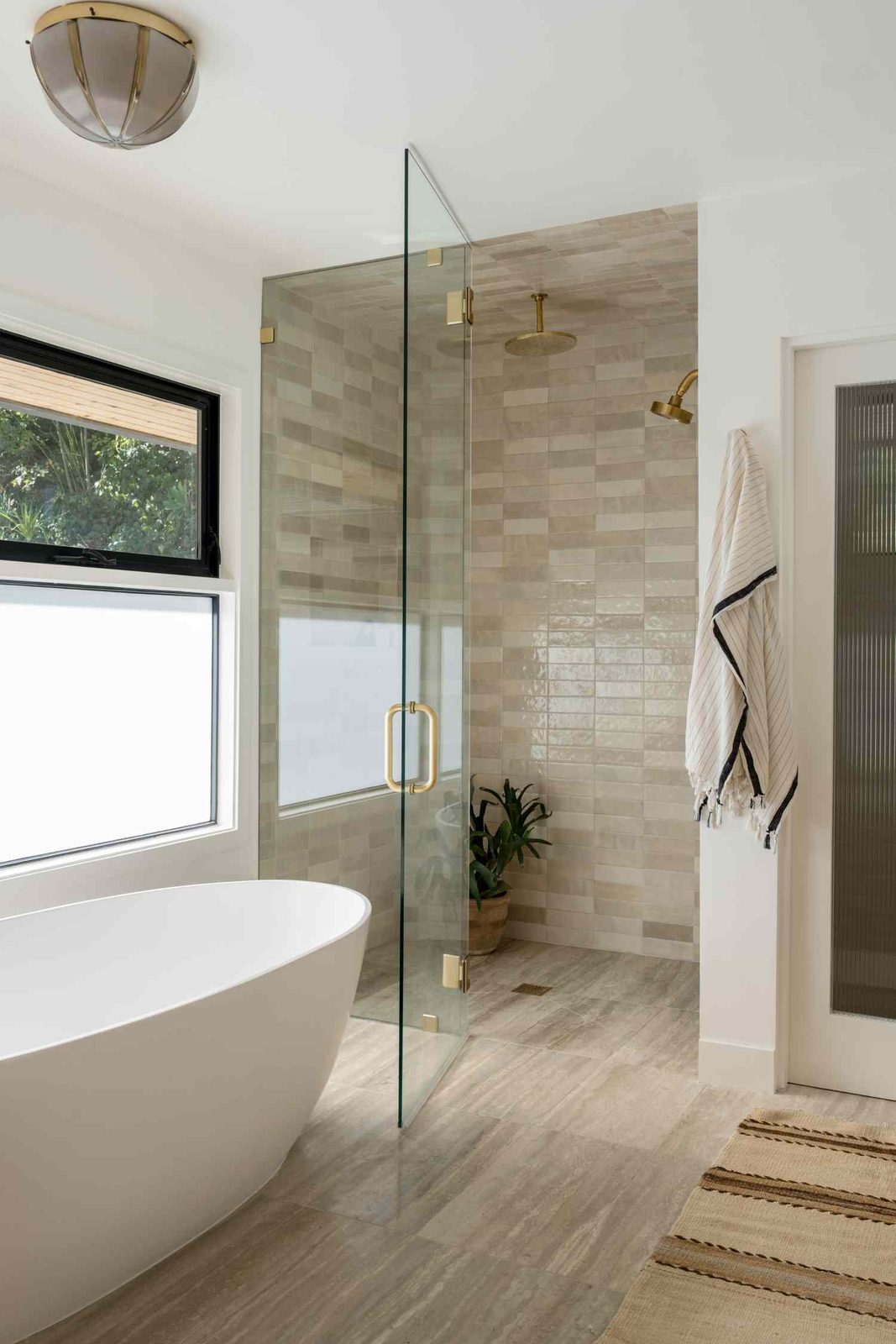 Walk-in shower design inspiration with gold fixtures